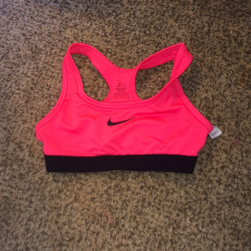 Neon pink nike sports bra.